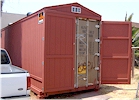 8' x 40' steel container covered with wood siding & shingle roof